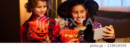 Halloween kids with treats taking selfie 119616595