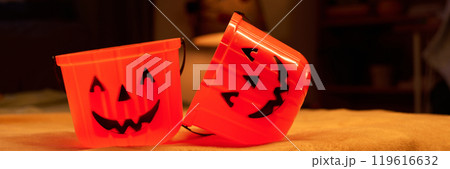 Two orange buckets for Halloween treats 119616632