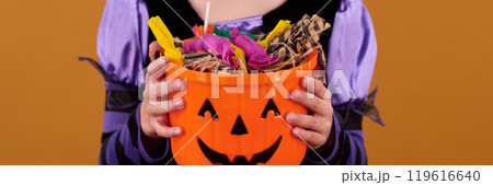 Hands of youthful girl holding treats 119616640