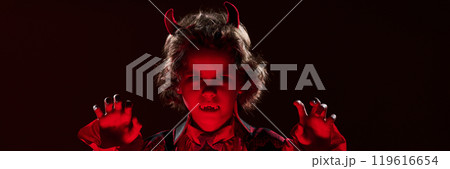 Little vampire with horns and fangs Little vampire with horns and fangs 119616654