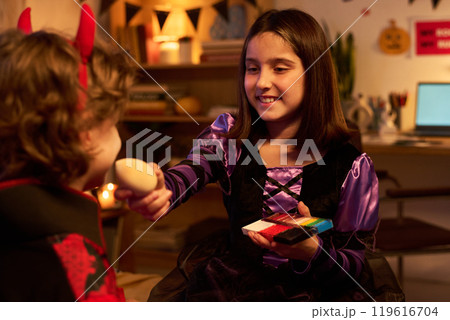 Kids getting ready for Halloween party Kids getting ready for Halloween party 119616704