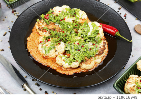 Grilled cabbage with cheese sauce. 119616949