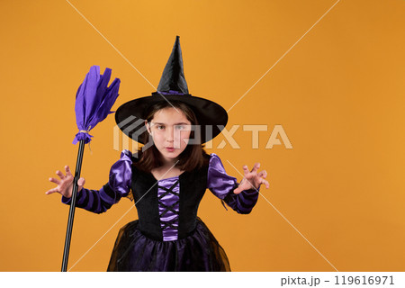 Cute little witch growling in isolation 119616971