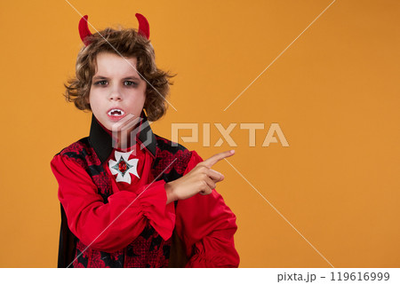 Little demon pointing aside at copyspace Little demon pointing aside at copyspace 119616999