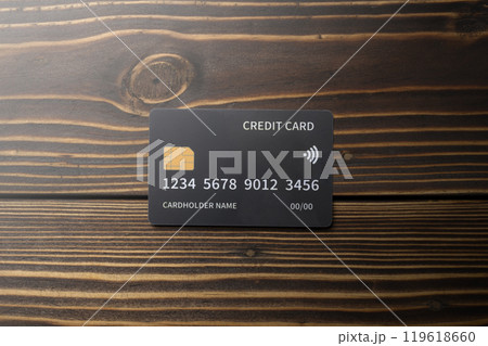 Top view of debit or credit card on wooden background 119618660
