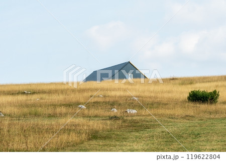 Isolated house with metal roof in grassy field. Durmitor National Park Isolated house with metal roof in grassy field. Durmitor National Park 119622804