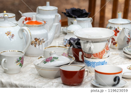 Vintage Teapots and Teacups on Display Table Vintage Teapots and Teacups on Display Table 119623059