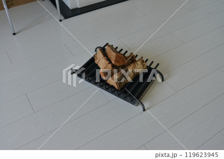 An object photo shoot of black grilles for fireplaces on a light background in the interior. An object photo shoot of black grilles for fireplaces on a light background in the interior. 119623945