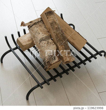 An object photo shoot of black grilles for fireplaces on a light background in the interior. 119623998