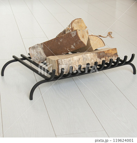 An object photo shoot of black grilles for fireplaces on a light background in the interior. 119624001