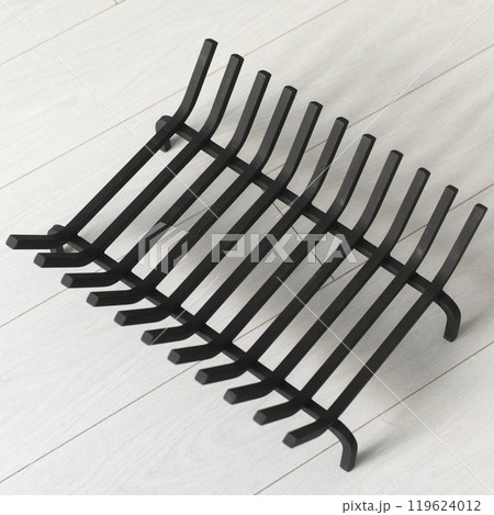 An object photo shoot of black grilles for fireplaces on a light background in the interior. An object photo shoot of black grilles for fireplaces on a light background in the interior. 119624012