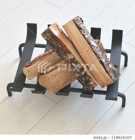 An object photo shoot of black grilles for fireplaces on a light background in the interior. An object photo shoot of black grilles for fireplaces on a light background in the interior. 119624167