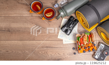 Lunch box, snacks on wooden background, concept of vacation nutrition, tourism, healthy snack, copy space, top view Lunch box, snacks on wooden background, concept of vacation nutrition, tourism, healthy snack, copy space, top view 119625212