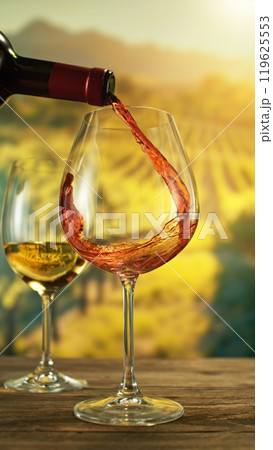 Detail of Red Wine Pouring on Vineyard. Detail of Red Wine Pouring on Vineyard. 119625553