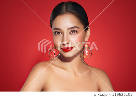 Portrait of beautiful young woman on red background Portrait of beautiful young woman on red background 119626105