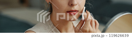 Applying Makeup with Mirror Reflection and Concentration Applying Makeup with Mirror Reflection and Concentration 119626639