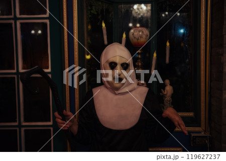 Scary female devilish nun with witch Cane for night Halloween 119627237