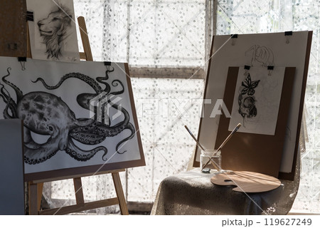 Painting animal artwork on paper board in art gallery 119627249