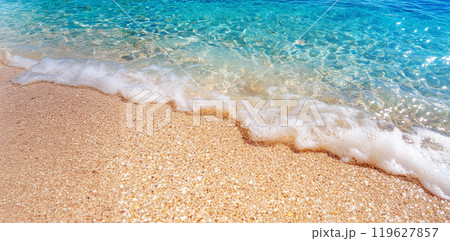 Summer seascape beautiful waves, blue sea water in sunny day, beach with a blue water and white sand Summer seascape beautiful waves, blue sea water in sunny day, beach with a blue water and white sand 119627857