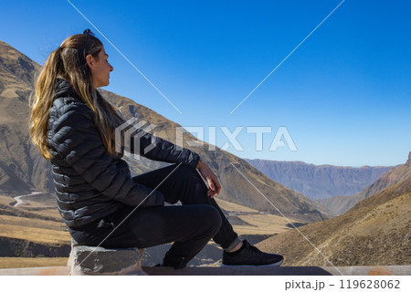 Tourist looking at a mountain landscape in northern Argentina. Tourist looking at a mountain landscape in northern Argentina. 119628062