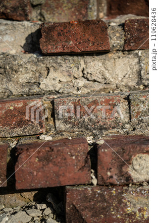 The ruins of the red brick fortress wall. Brick wall background The ruins of the red brick fortress wall. Brick wall background 119628436