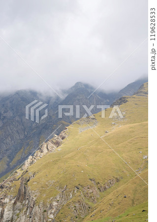 Mountain landscape. summer day in wild mountains with coniferous forest and rocky slopes. Mountain landscape. summer day in wild mountains with coniferous forest and rocky slopes. 119628533