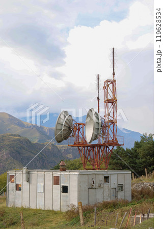 Telecommunications satellite dish radio telescope in mountains. Earth based astronomical locator Telecommunications satellite dish radio telescope in mountains. Earth based astronomical locator 119628534