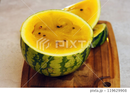 Delicious yellow watermelon sliced open to reveal its vibrant, sweet interior, perfect for summer 119629908