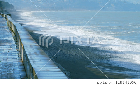 Pebble beach, surf. City embankment illuminated by lanterns. Kobuleti, Adjara, Georgia. Pebble beach, surf. City embankment illuminated by lanterns. Kobuleti, Adjara, Georgia. 119641956