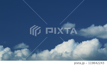 Airy Snow-White Clouds Move. Climate And Weather. Beautiful Background Sunny Cloudy Blue Skyscraper. Airy Snow-White Clouds Move. Climate And Weather. Beautiful Background Sunny Cloudy Blue Skyscraper. 119642243