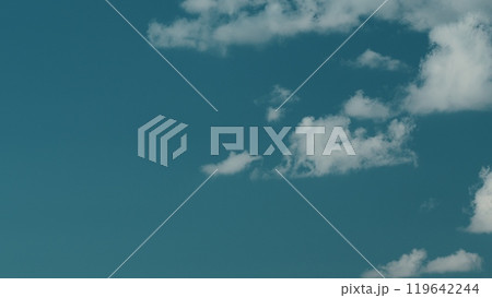 Soft White Cumulus Clouds Move In Blue Sky. Beautiful Nature. Natural Background. Soft White Cumulus Clouds Move In Blue Sky. Beautiful Nature. Natural Background. 119642244