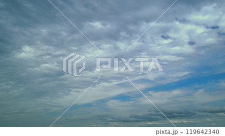Tropical Summer Sunlight. Various Layers Of Clouds Move In Different Directions At Altitude. 119642340