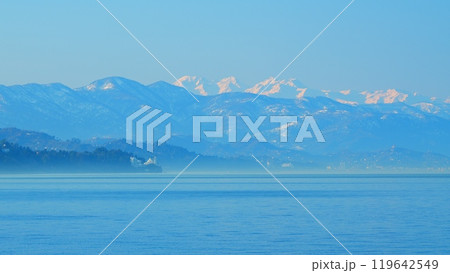Beautiful Views Of The Sea And The Snow-Capped Mountains. Snow Capped Mountain And Sky. Pan. Beautiful Views Of The Sea And The Snow-Capped Mountains. Snow Capped Mountain And Sky. Pan. 119642549