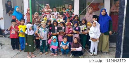group of happy elementary pupils reading group of happy elementary pupils reading 119642570