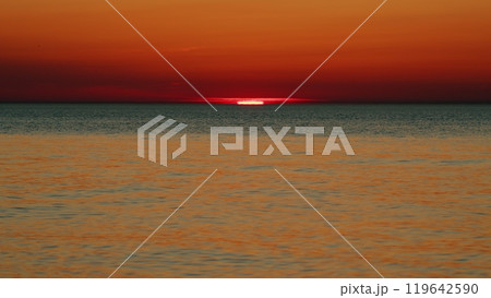 Beautiful Sunset Above Sea. Vibrant Color Panoramic Sun Rise And Sun Set Clear Sky. Nobody. Slow motion. Beautiful Sunset Above Sea. Vibrant Color Panoramic Sun Rise And Sun Set Clear Sky. Nobody. Slow motion. 119642590