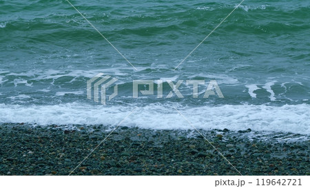 Calm Turquoise Water Hitting Sandy Beach On Seashore. Sea Waves Run On Shore Of Sea Or Ocean. Slow motion. Calm Turquoise Water Hitting Sandy Beach On Seashore. Sea Waves Run On Shore Of Sea Or Ocean. Slow motion. 119642721