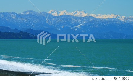 Beautiful Views Of The Sea And The Snow-Capped Mountains. Snow Capped Mountain And Sky. Still. 119643007