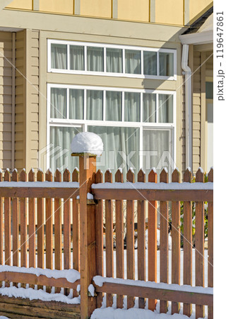 Bright sunny winter day on front yard of residential house in Canada 119647861