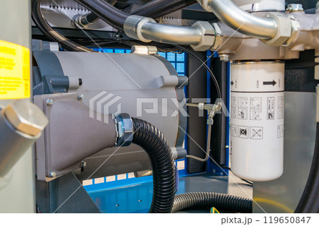 Industrial air compressor showing internal components with pipes and filter 119650847