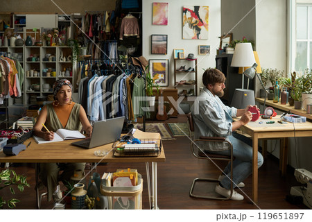 Workers or owners of modern thrift shop 119651897