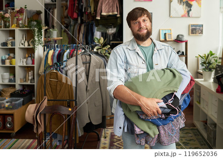Happy young customer of thrift shop Happy young customer of thrift shop 119652036