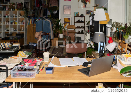 Workplace of thrift shop assistant 119652083
