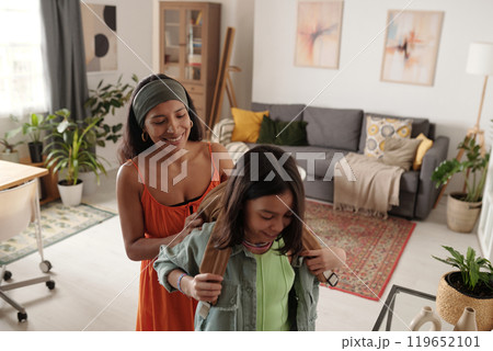 Mother Helping Daughter Prepare for School Day Mother Helping Daughter Prepare for School Day 119652101