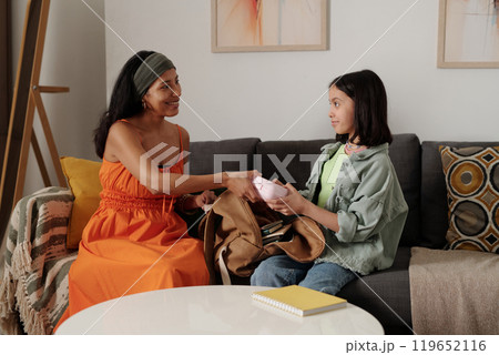 Mother and Daughter Sharing Special Moment on Sofa 119652116