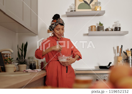 Mixing Ingredients in Cozy Home Kitchen Setting Mixing Ingredients in Cozy Home Kitchen Setting 119652152