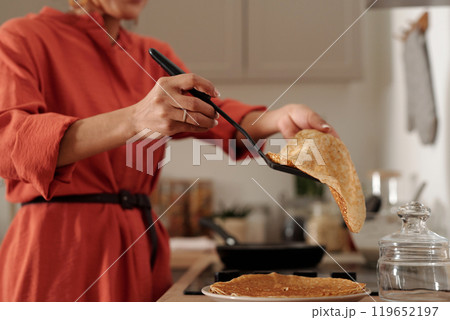 Flipping Pancakes in Modern Home Kitchen 119652197