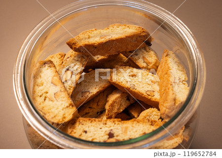 Top view of glass jar filled with Italian cantucci cookies golden brown with almonds Top view of glass jar filled with Italian cantucci cookies golden brown with almonds 119652784