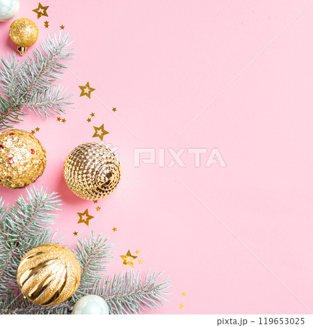 Pink Christmas Background with fir branches and golden baubles Pink Christmas Background with fir branches and golden baubles 119653025