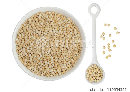 Sorghum seeds in ceramic bowl isolated on white background. Top view. Flat lay. Sorghum seeds in ceramic bowl isolated on white background. Top view. Flat lay. 119654331