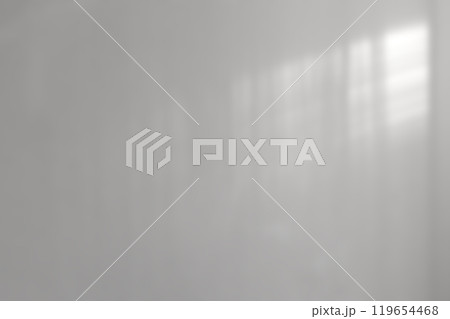 Light and shadow on an abstract gray background. Light and shadow on an abstract gray background. 119654468